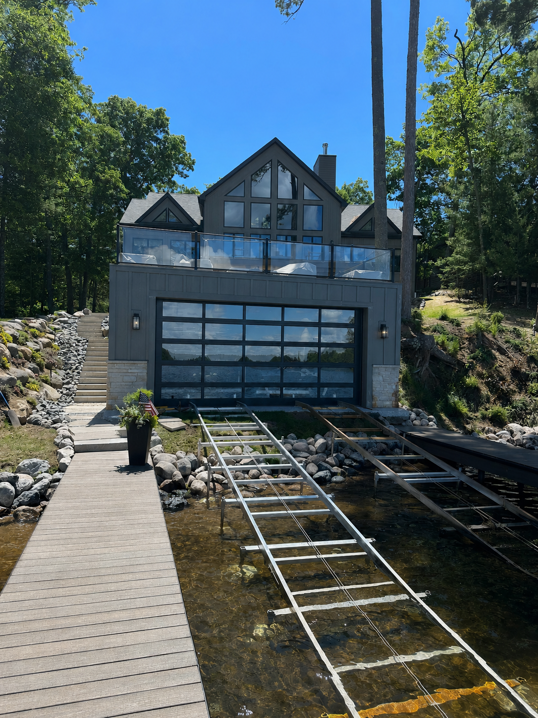 After - Minocqua boathouse with C.H.I. full-vision glass doors