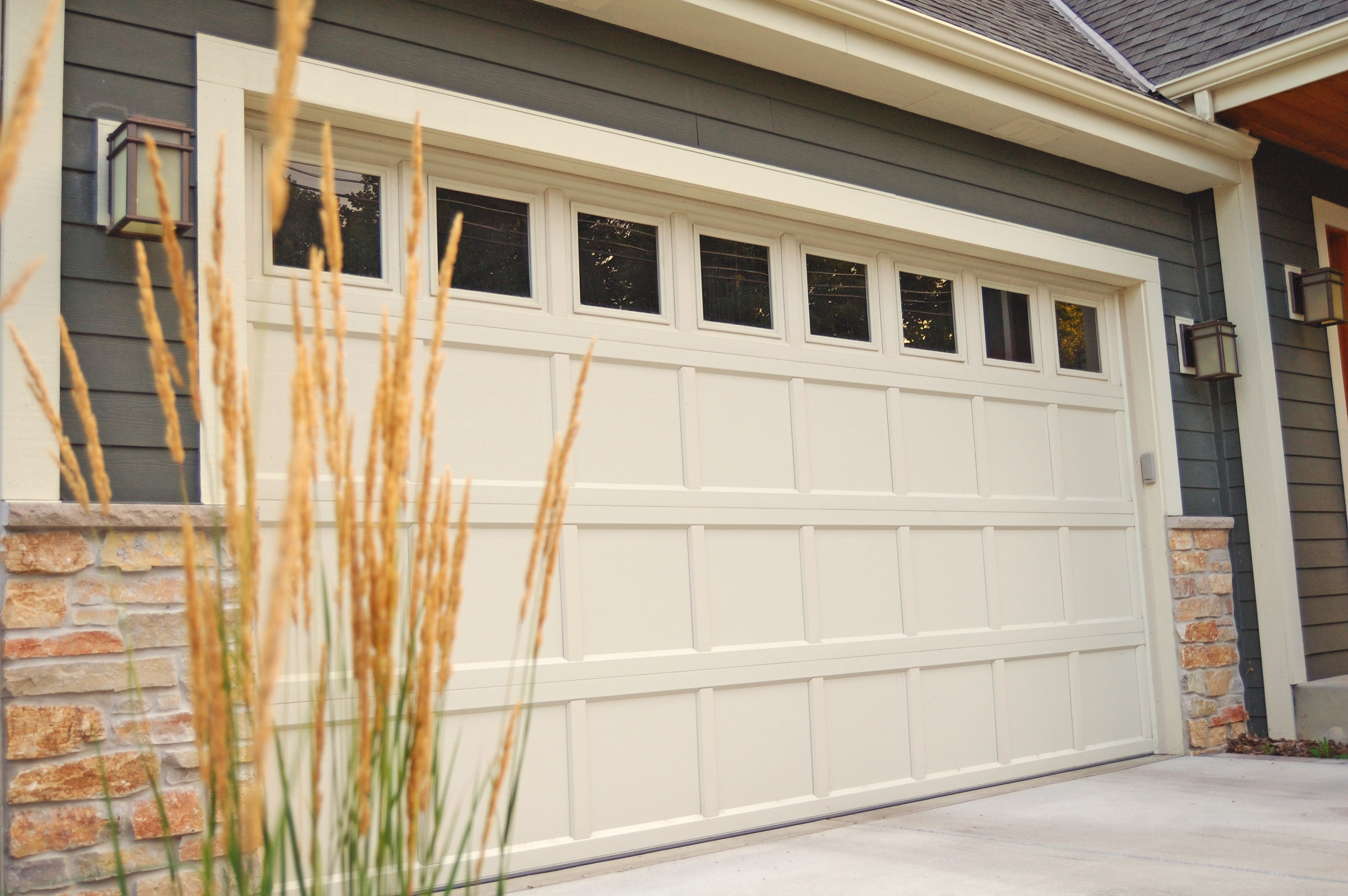 Modern residential garage door with windows